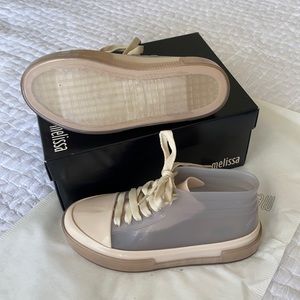 Brand new, never worn jelly Melissa sneakers. Translucent/beige. Smell amazing!!